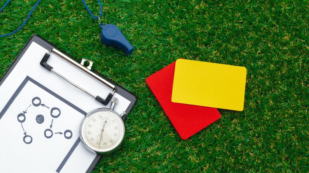 Two Penalty Cards And A Whistle For The Referee